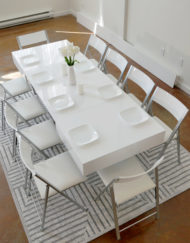 White-Gloss-Box-Coffee-table-with-10-nano-white-chairs-around-it-bright