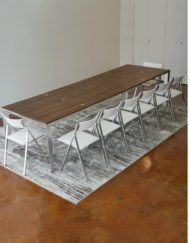 mega-abode-super-extended-14-person-table-in-chocolate-walnut-with-silver-legs-and-nano-chairs-around-it