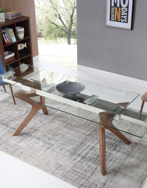 A-transparent-glass-rectangular-table-with-extensions-on-branch-like-wood-legs